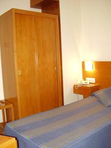 Cama ou camas em um quarto em Hotel das Taipas