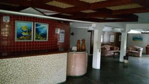 Posezení v ubytování Flat Condominio Gaivotas Alcobaça BA a 100 metros do mar