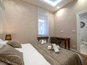 Krevet ili kreveti u jedinici u okviru objekta Main Square Residence