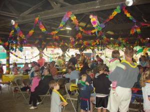 a crowd of people in a party with kites at Yogi Bear's Jellystone Park Camp-Resort Wisconsin Dells in Wisconsin Dells +231 photos