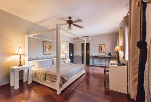 Postel nebo postele na pokoji v ubytování Hotel Hacienda Mérida + 34 fotografií