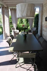 a black table and chairs on a patio at B&B a Ca' Minore Franciacorta in Passirano
