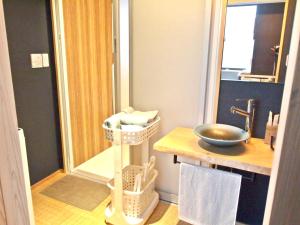 a bathroom with a sink and a shower with a mirror at Shounsai in Kyoto +49 photos