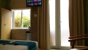 TV a/nebo společenská místnost v ubytování An Bang Beach Town Homestay