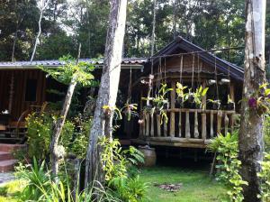 a cabin in the woods with trees at Koh Kood Little Hut in Ko Kood