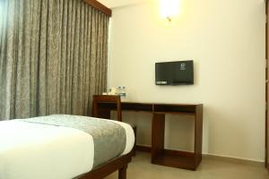 TV a/nebo společenská místnost v ubytování Niko Hotels