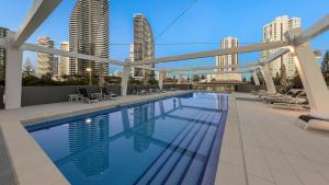 a large swimming pool in the middle of a building at Avani Broadbeach Residences in Gold Coast