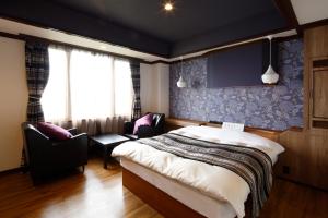 Letto o letti in una camera di Hotel Sunset (Adult Only)