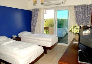 Ένα ή περισσότερα κρεβάτια σε δωμάτιο στο Philae Hotel Aswan