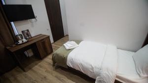 Voodi või voodid majutusasutuse Hotel King Tom toas