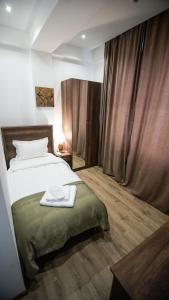 Voodi või voodid majutusasutuse Hotel King Tom toas