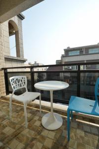 Un balcón o terraza en 日晴民宿 Sun Day