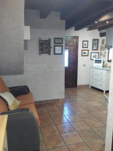 a living room with a couch and a table at Los Masecicos in Mora de Rubielos