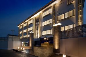 a building with lights on the side of it at WA HOTEL TIMELESS RESORT - Adult Only in Wakayama