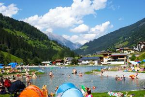a group of people in the water at a beach at Haus Lydia in See