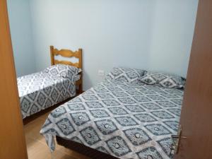 En eller flere senge i et værelse på Coração do Centro