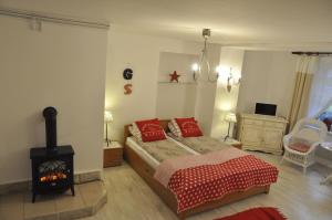 a bedroom with a bed and a wood stove at Apartamenty MARINE in Świnoujście