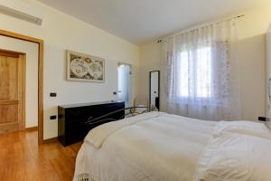 A bed or beds in a room at B&B Il Ramaiolo