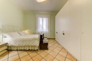 A bed or beds in a room at B&B Il Ramaiolo