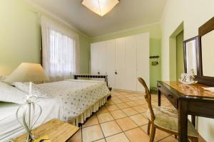 A bed or beds in a room at B&B Il Ramaiolo