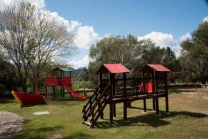 a group of playground equipment in a park at Casa Valery Wonderful Sea View in Porto Rotondo