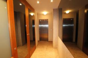 a hallway with three elevators in a building at Apartamento Puerto-Terol in Alicante