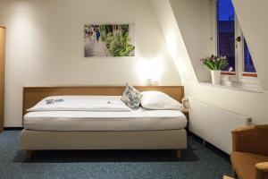 Postel nebo postele na pokoji v ubytování martas Hotel Allegra Berlin + 35 fotografií