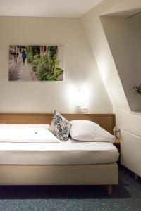 Postel nebo postele na pokoji v ubytování martas Hotel Allegra Berlin