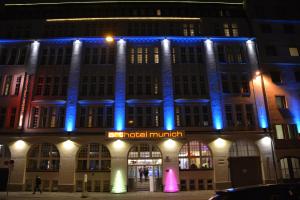 a building with blue lights on the front of it at Arthotel Munich in Munich