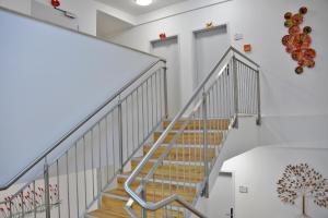 a staircase in a building with white walls at Arthotel Munich in Munich