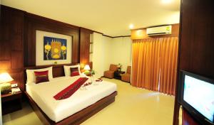 Postel nebo postele na pokoji v ubytování Arita Hotel Patong + 29 fotografií