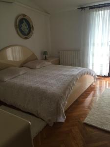 Postel nebo postele na pokoji v ubytování Apartments Villa Ivanka