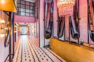 a corridor of a building with a hallway of a room at Room Mate Emir in Istanbul