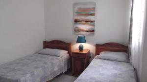 Postel nebo postele na pokoji v ubytování Hideaway Flats