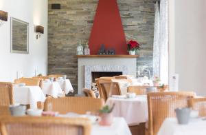 Restoran või mõni muu söögikoht majutusasutuses Boutique-HOTEL REMORINO, a Private Selection Hotel
