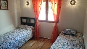 Posteľ alebo postele v izbe v ubytovaní Villa Chabola