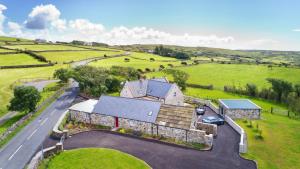 an aerial view of a house in a field at The Hazel in Doolin