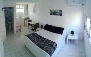 Кровать или кровати в номере Hotel Club de La Barra