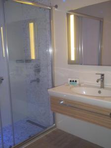 a bathroom with a shower and a sink at Blue Bay Platinum in Marmaris