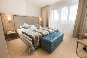 Łóżko lub łóżka w pokoju w obiekcie Villa Bravo & SPA