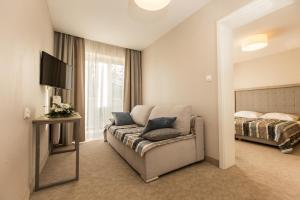 Łóżko lub łóżka w pokoju w obiekcie Villa Bravo & SPA