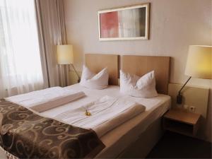 Postel nebo postele na pokoji v ubytování Hotel Goldener Anker