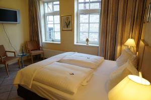 Postel nebo postele na pokoji v ubytování Hotel Goldener Anker