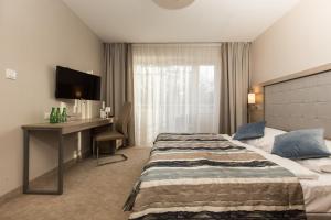 Łóżko lub łóżka w pokoju w obiekcie Villa Bravo & SPA