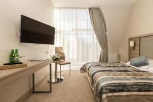 Łóżko lub łóżka w pokoju w obiekcie Villa Bravo & SPA