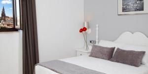 Postel nebo postele na pokoji v ubytování Hotel Carlos V