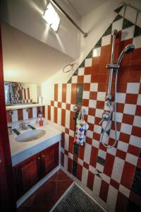 a bathroom with a sink and a shower at Il Carretto Taormina Center in Taormina