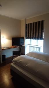 Postel nebo postele na pokoji v ubytování Hotel Kaiserhof am Dom