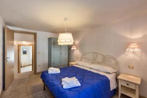 Albergo Diffuso Sutrio Zoncolan客房内的一张或多张床位
