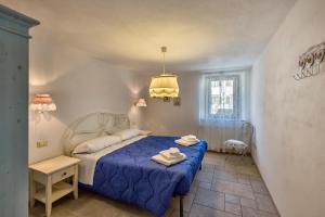 Albergo Diffuso Sutrio Zoncolan客房内的一张或多张床位